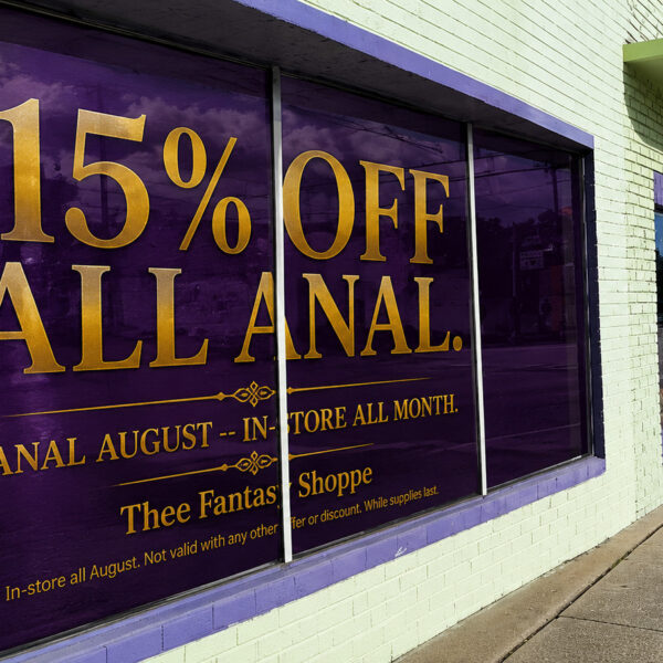 Purple Thee Fantasy Shoppe popup with a gold crown and book promoting its Anal August sale.